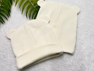 کلاه دو لایه  گرد گوش دار کبریتی نوزادی رنگ شیری