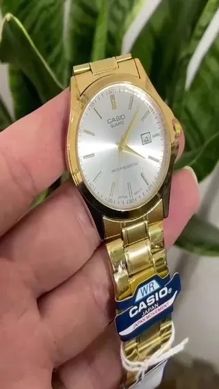 ساعت کاسیو مردانه casio  موتور ژاپن بدنه استیل رنگ ثابت تاریخ دار طلایی صفحه سفید با جعبه 