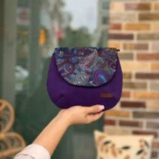 کیف نقلی بنفش طرحدار